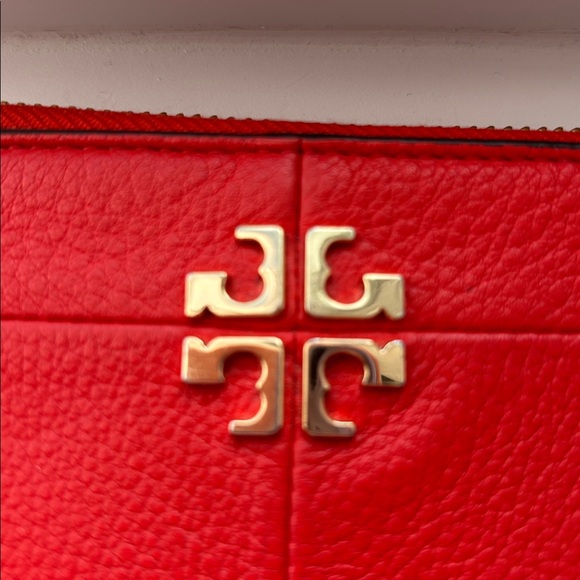 Tory Burch orange leather wristlet wallet. - Picture 2 of 4
